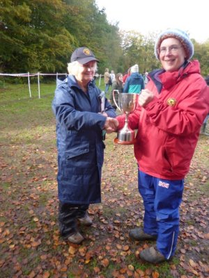 Wendy receiving the Popplewell Trophy from the League Treasurer, Liz Flitcroft